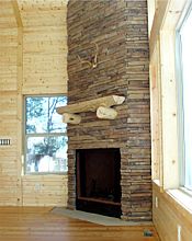 Stone fireplace, pine paneling, Douglas fir floors